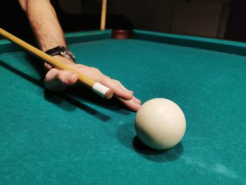 Person playing with ball on table