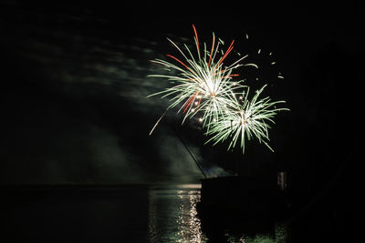 Firework display at night