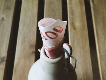 Close-up of coffee cup on wooden table