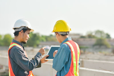 Side view of man working at construction site