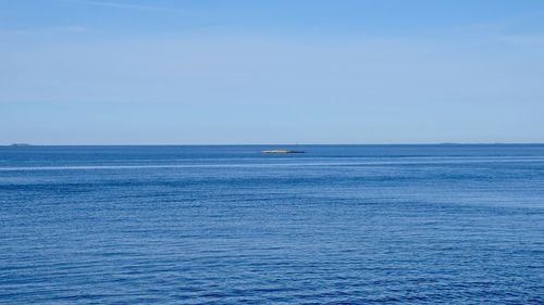 Scenic view of blue sea against sky