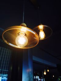 Low angle view of lit lamp