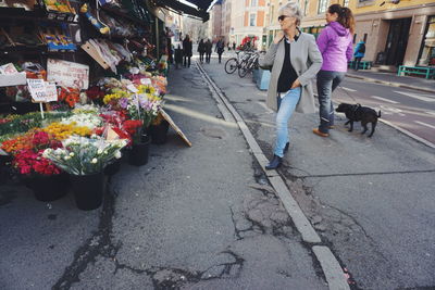 People walking on street in city