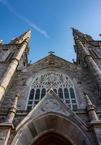 Low angle view of ornate building against sky