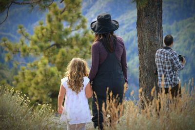 Rear view of woman standing in park