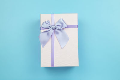 Close-up of paper box against blue background