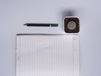 Directly above shot of pencils on white table