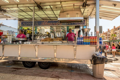 People at market stall