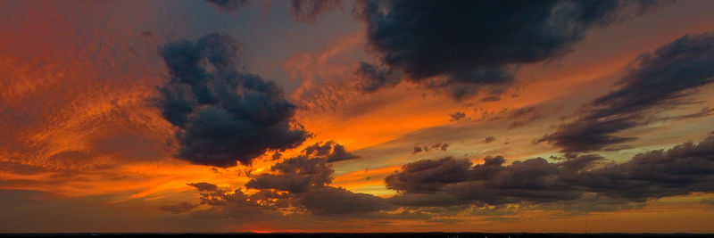 Low angle view of dramatic sky during sunset