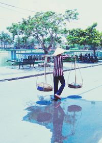 Man in water against sky