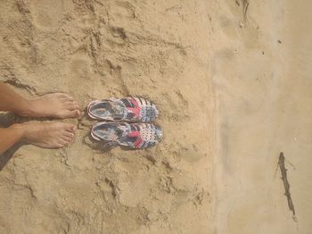 Low section of woman standing on wall