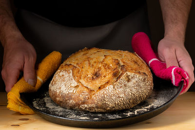 Cropped hand of person holding food