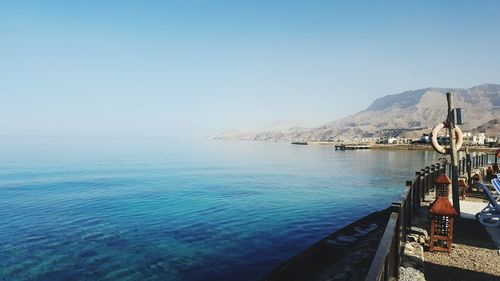 Scenic view of sea against blue sky