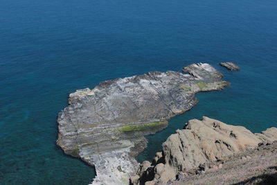 High angle view of rock formation in sea