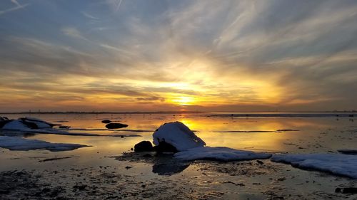 Scenic view of sea against sky during sunset