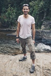 Portrait of smiling young man standing outdoors