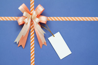 High angle view of ribbon tied on gift box