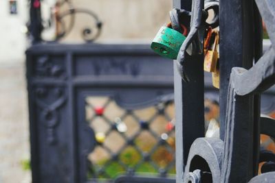 Close-up of padlocks hanging on metal