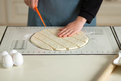 Midsection of man working on table