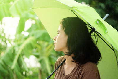 Portrait of young woman looking away