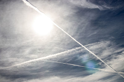 Low angle view of vapor trails in sky