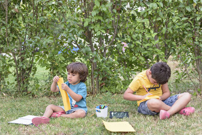 Side view of boy playing in park