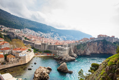 Dubrovnik west pier and medieval fortifications of the city seen from fort lovrijenac