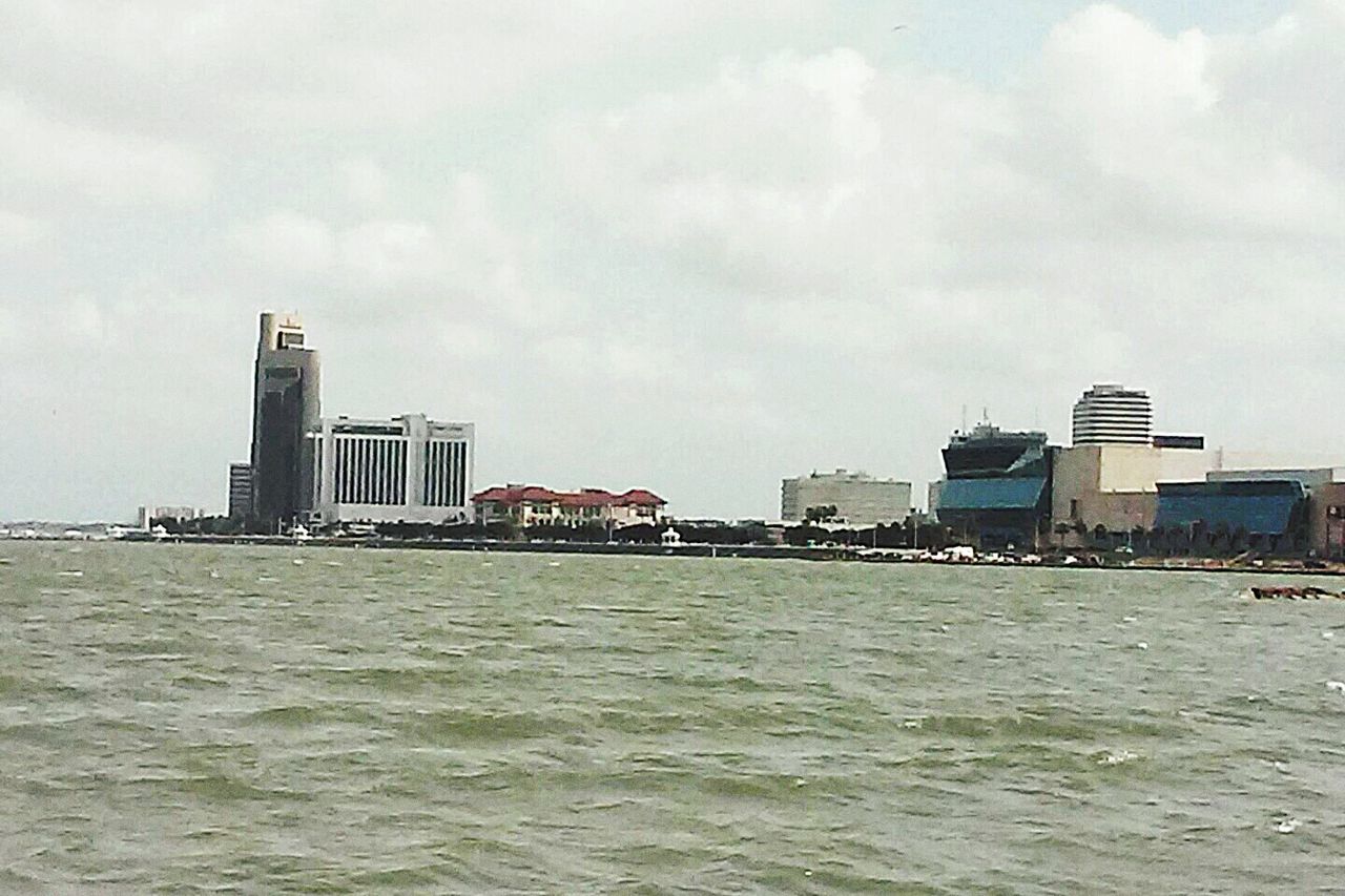 water, waterfront, building exterior, architecture, sea, built structure, sky, cloud - sky, rippled, nautical vessel, cloud, cloudy, day, nature, boat, city, outdoors, no people, horizon over water, transportation