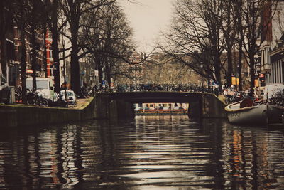 Canal passing through city at night