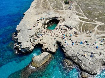 Aerial view of rock formation by sea