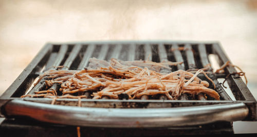 Close-up of meat on barbecue grill