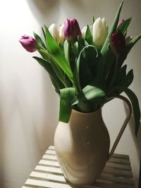 Close-up of flower vase on table at home