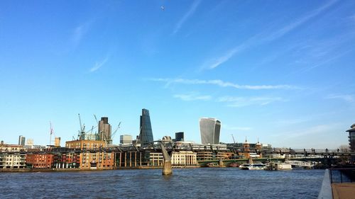 View of cityscape against blue sky