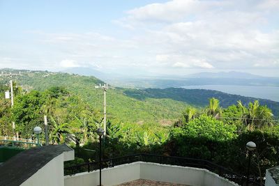 Scenic view of mountains against cloudy sky