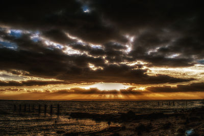 Scenic view of sea against dramatic sky