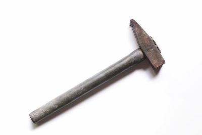 High angle view of cross on wood against white background