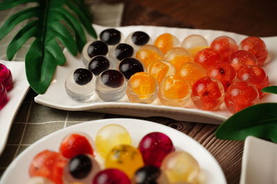 Close-up of fruits served in plate on table
