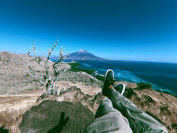 Scenic view of sea against clear blue sky