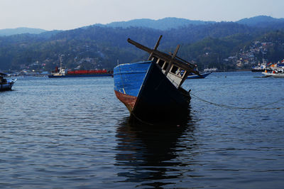 Boats in calm lake