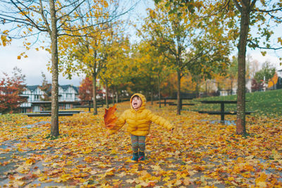Full length of man standing in park during autumn
