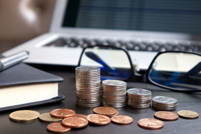 Close-up of coins on table
