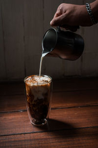 Glass of coffee cup on table