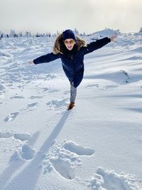 Man standing on snow covered field