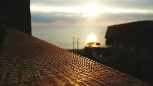 Close-up of water against sky at sunset