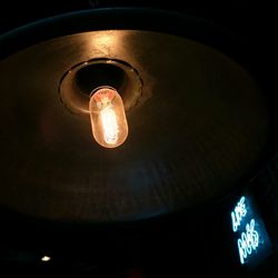 Low angle view of illuminated light bulb