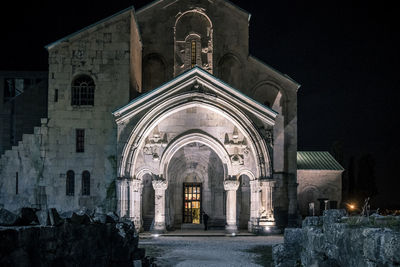 Facade of historic building at night