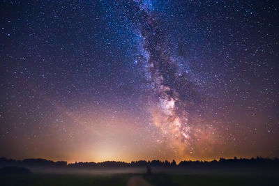 Fireworks against star field at night