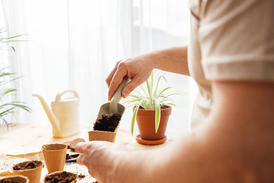 Midsection of woman preparing food on table