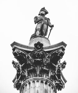 Low angle view of statue against clear sky