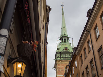 Low angle view of clock tower in city